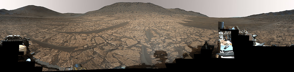 A panorama of an ancient river delta on Mars called Jezero Crater, where NASA's Perseverance rover (partially seen in the foreground) found a rock that may hold hints of ancient life on the Red Planet.